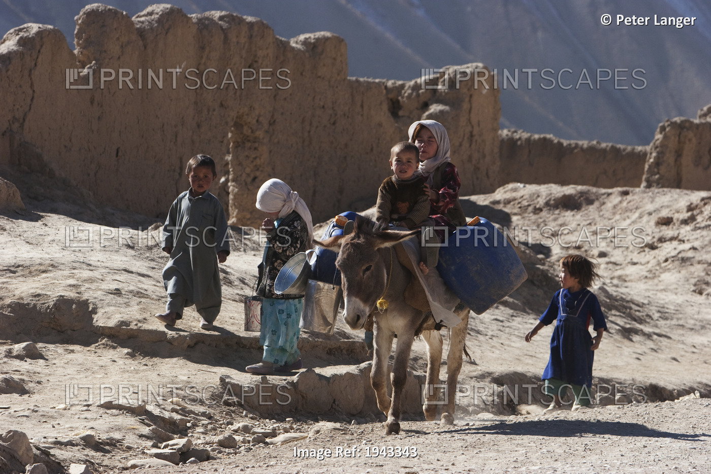 Boy And Girl On A Donkey In Bamiyan, Bamian Province, Afghanistan