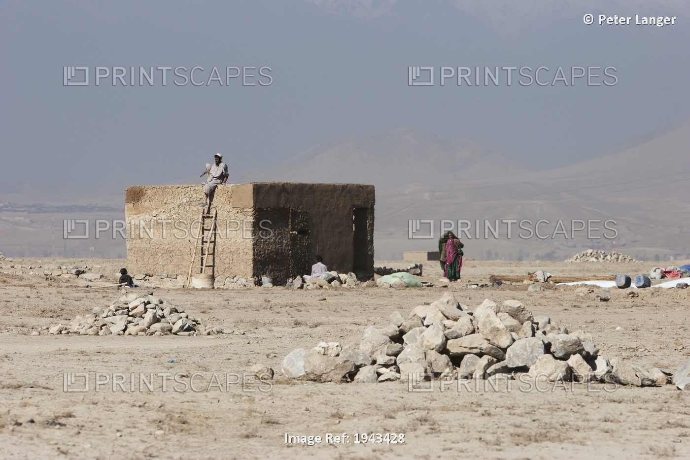 Man And Woman By A Brick House In The Outskirts Of Kabul, Afghanistan