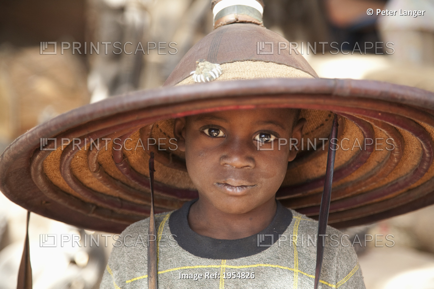 Dogon boy wearing a hat in Tireli, Mali