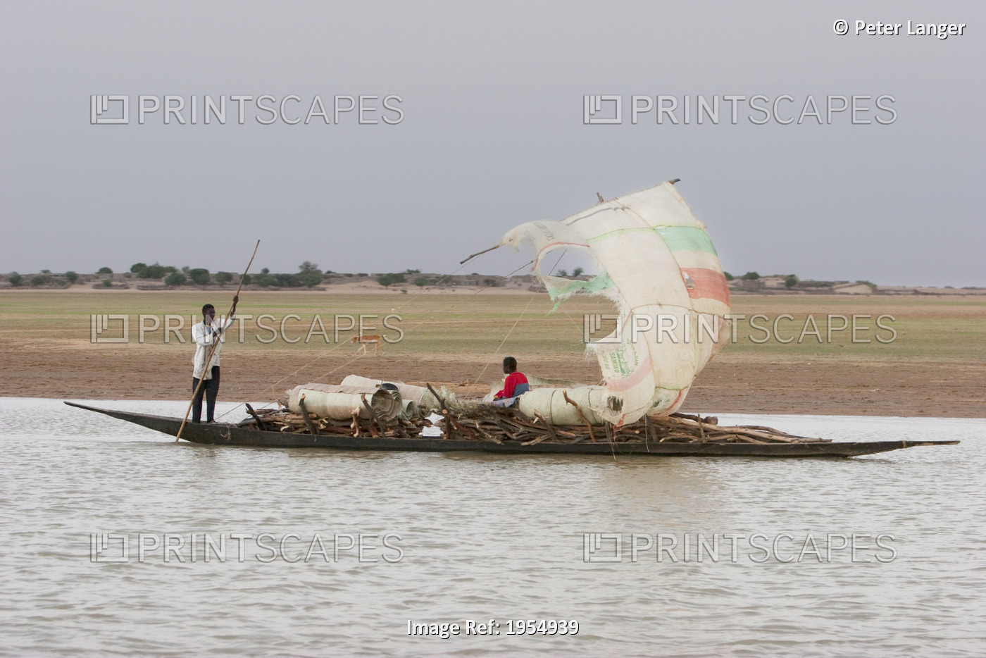 People on sail boat at the Niger River between Lake Debo and Sebi, Mali