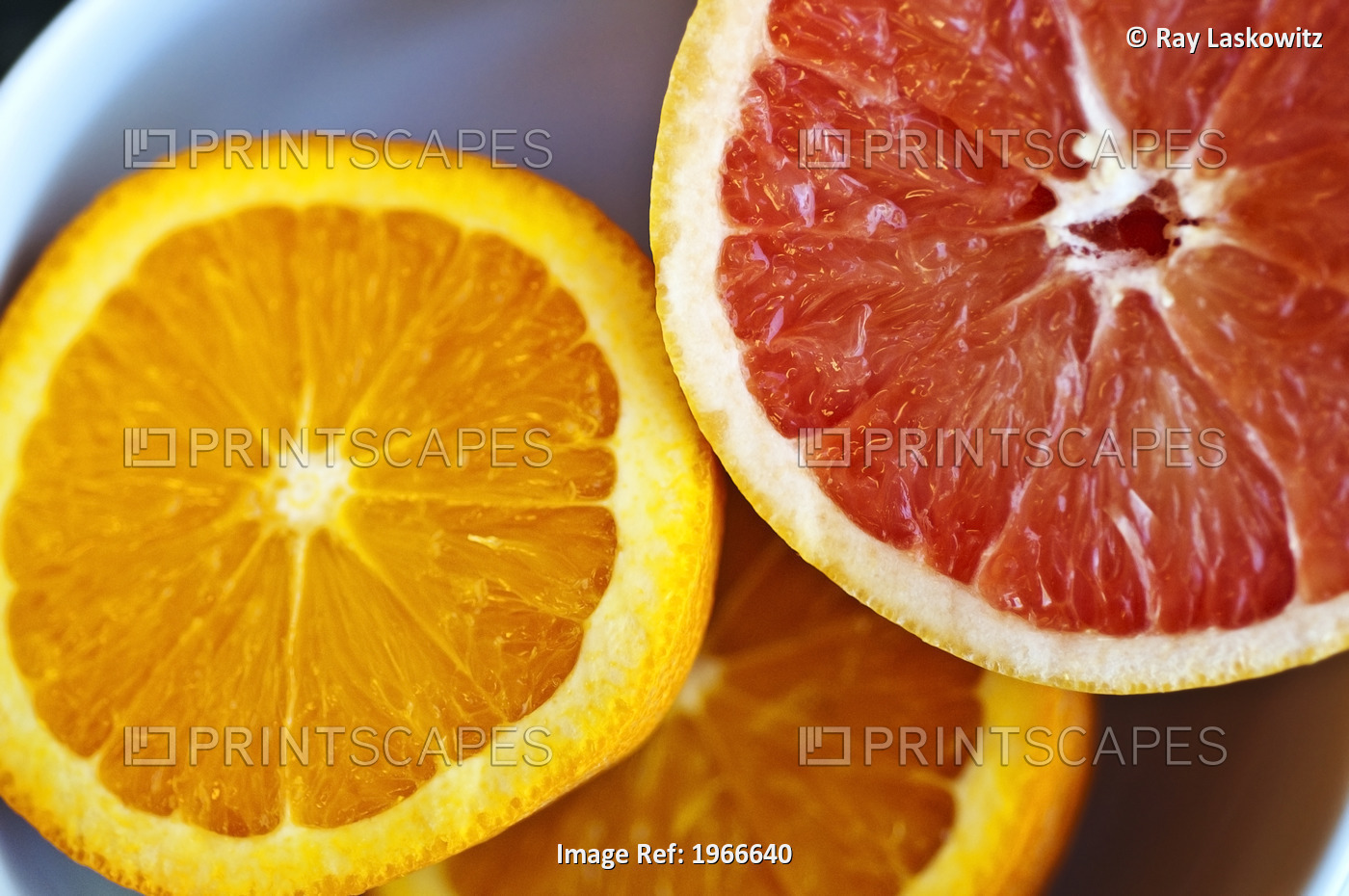 Orange And Pink Grapefruit Halves, Fresh Cut.