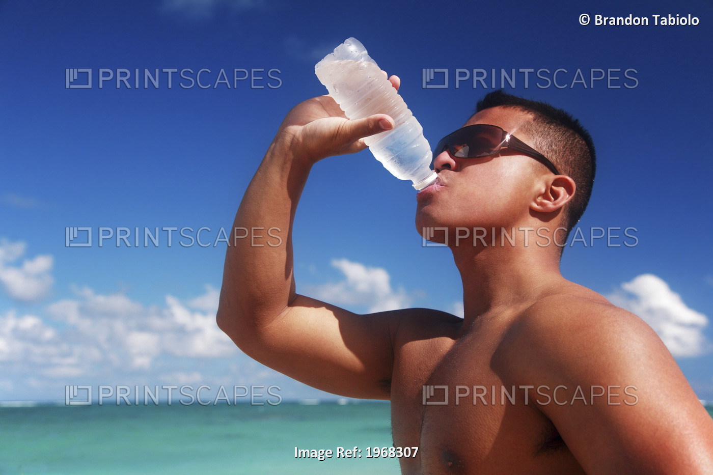 Hawaii, Oahu, Fit Male Drinking Water At The Beach.