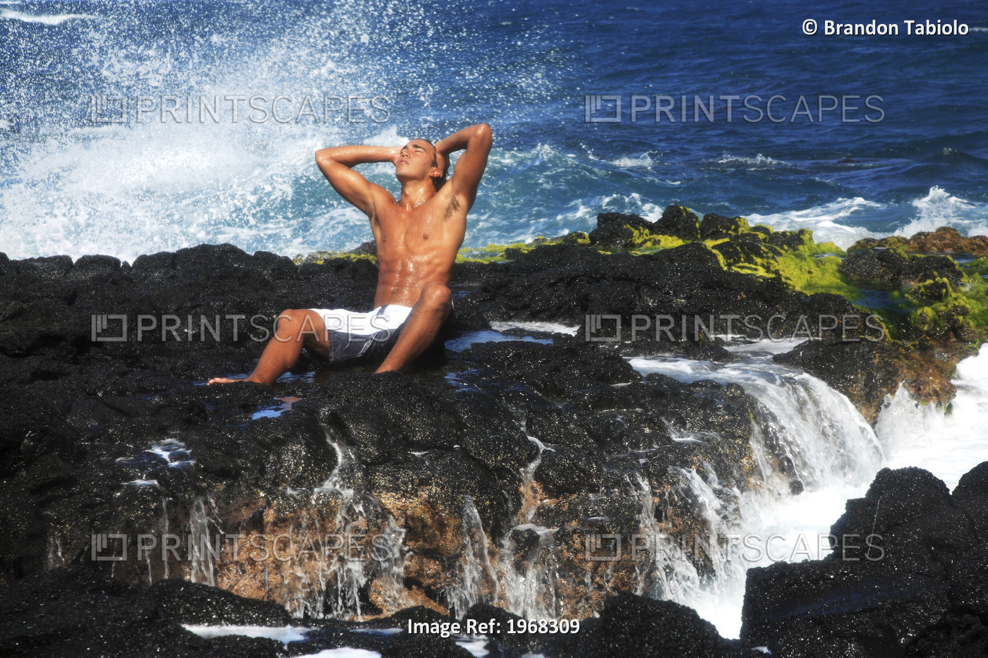 Hawaii, Oahu, Local Young Man Enjoying Sea Mist On A Sunny Day On The Rocks On ...