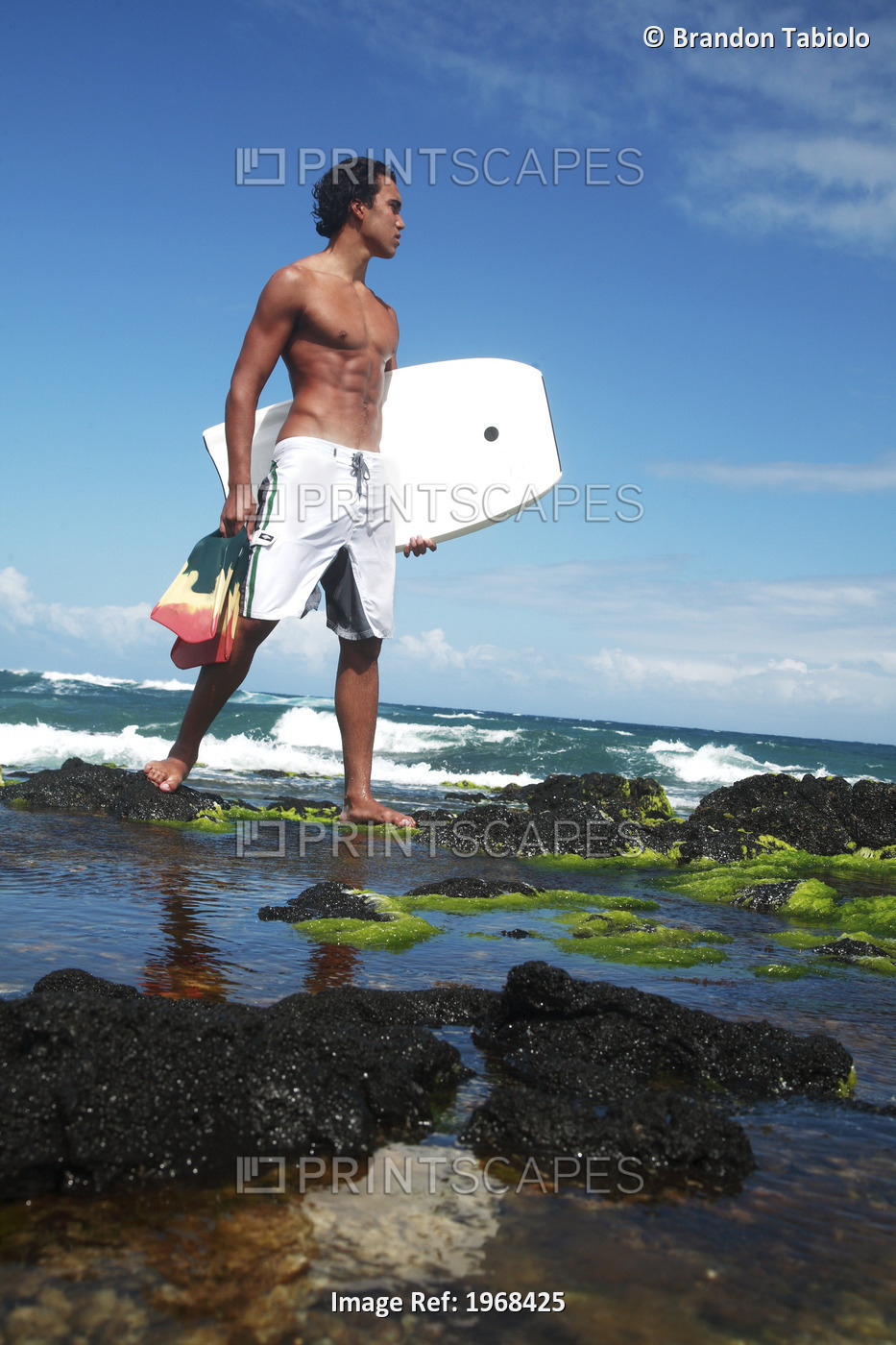 Hawaii, Oahu, Local Bodyboarder Standing On Tidepool Of Rocks Near The ...