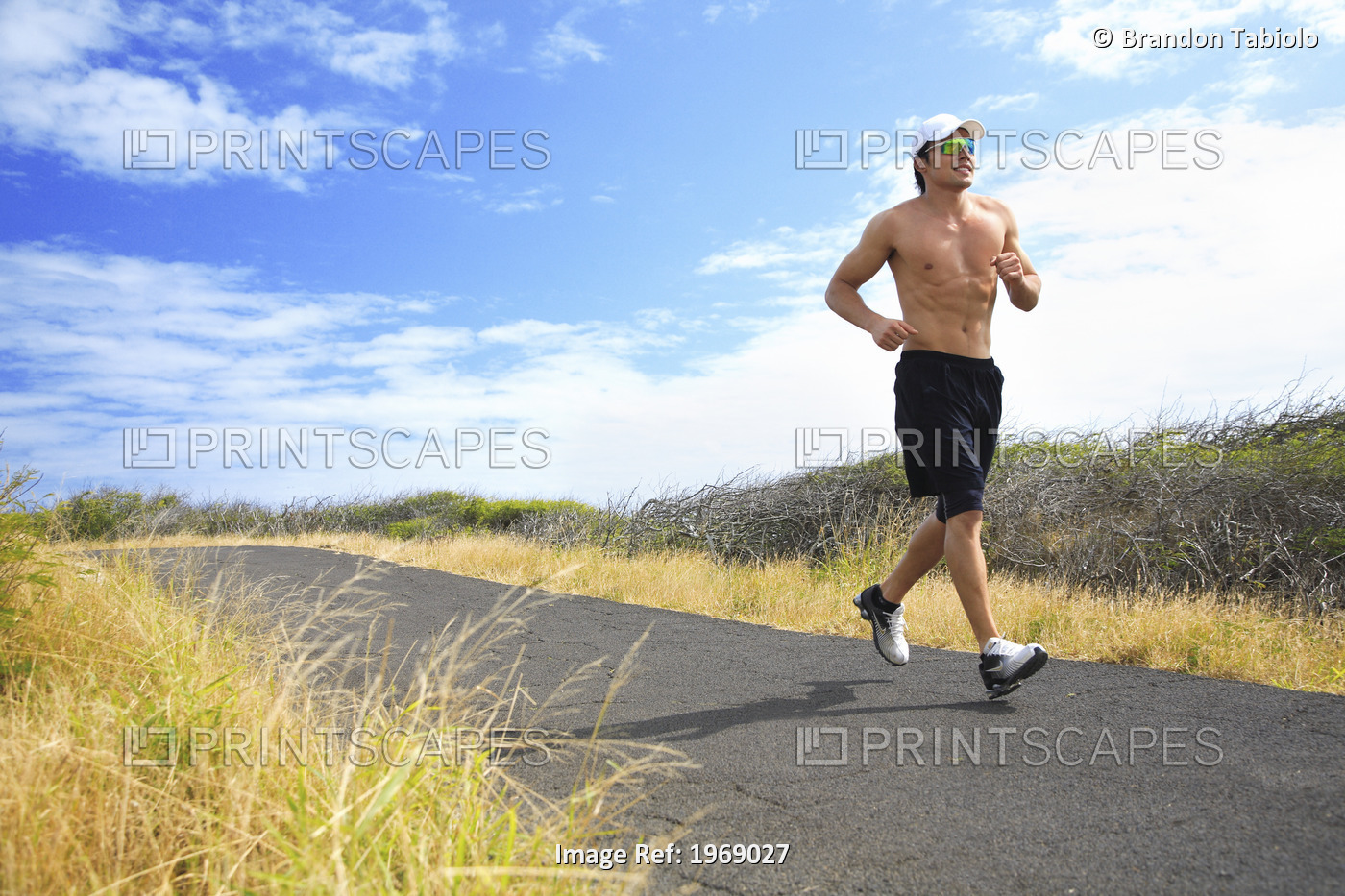 Hawaii, Oahu, Makapu'u, Athletic Male Running Along The Makapuu Hiking Trail