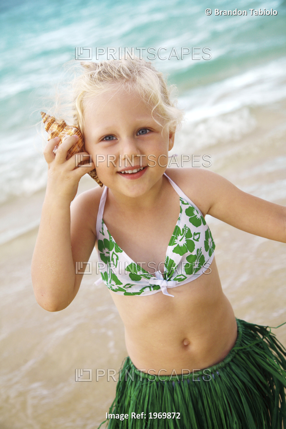 Hawaii, Oahu, Young Girl In A Hula Skirt Listening To A Shell.
