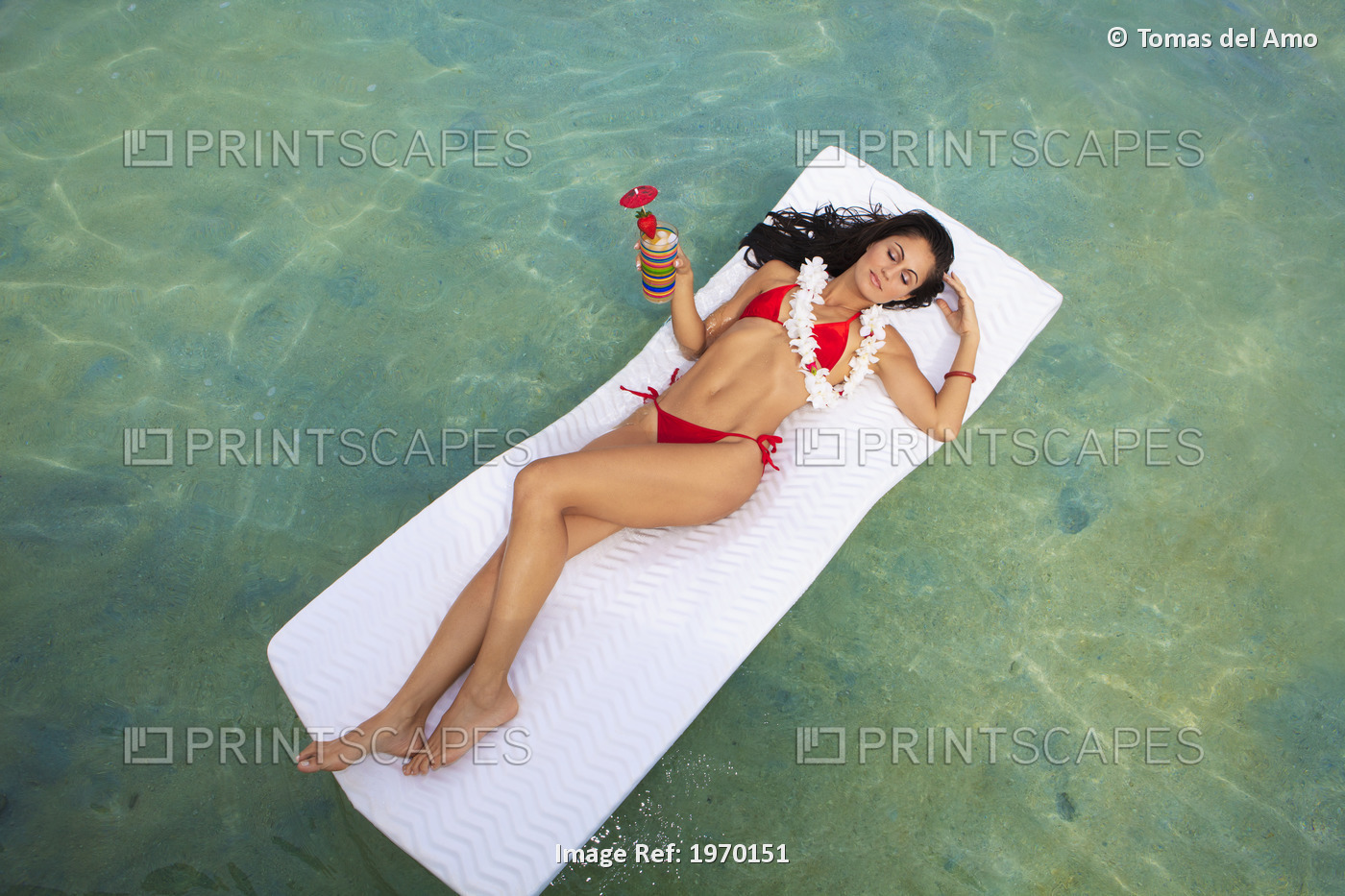 Hawaii, Oahu, Kaneohe Bay, Woman Floating On A Raft With A Tropical Drink