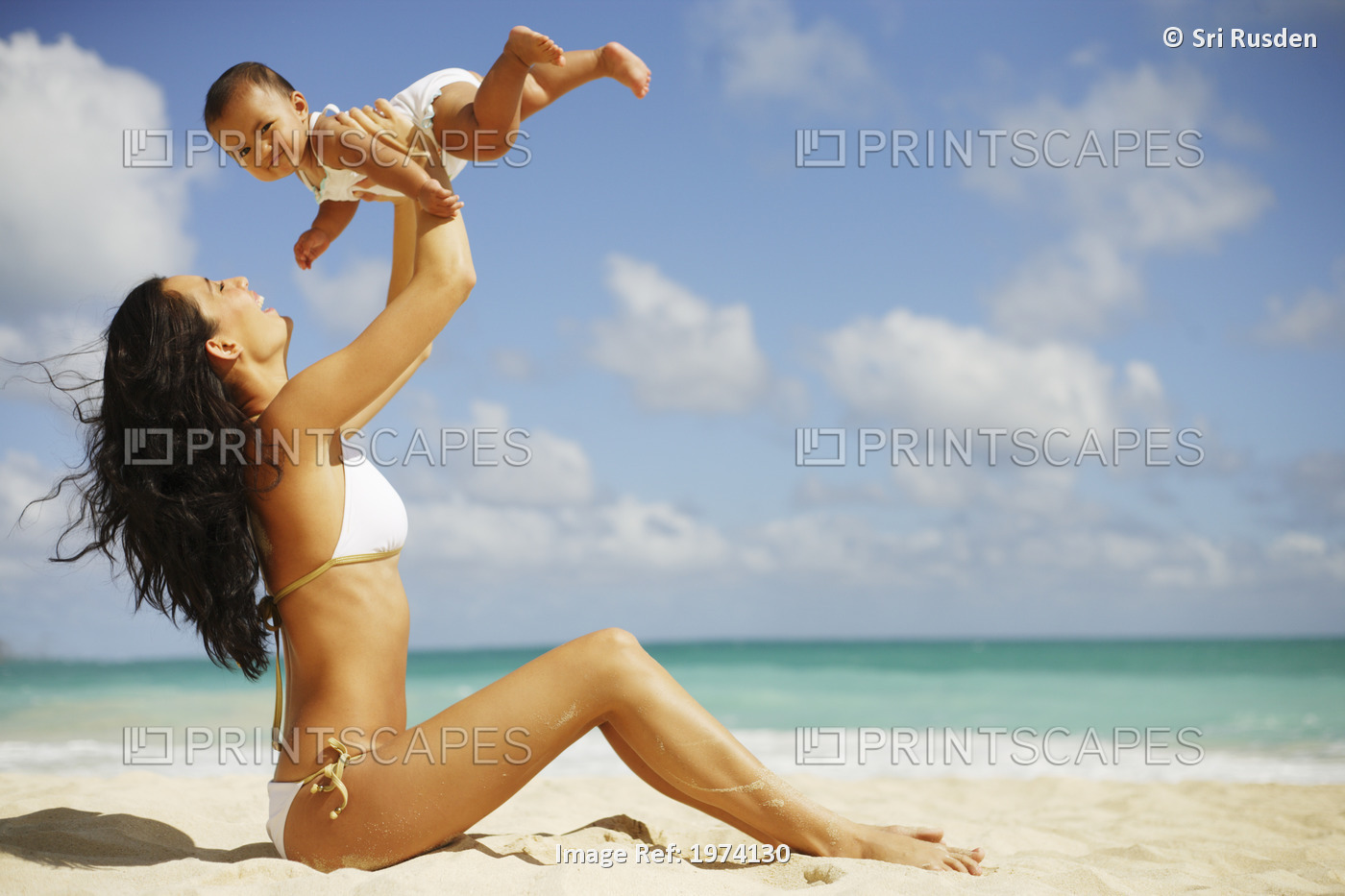 Hawaii, Oahu, Mother And Her Baby Enjoy A Day At The Beach.