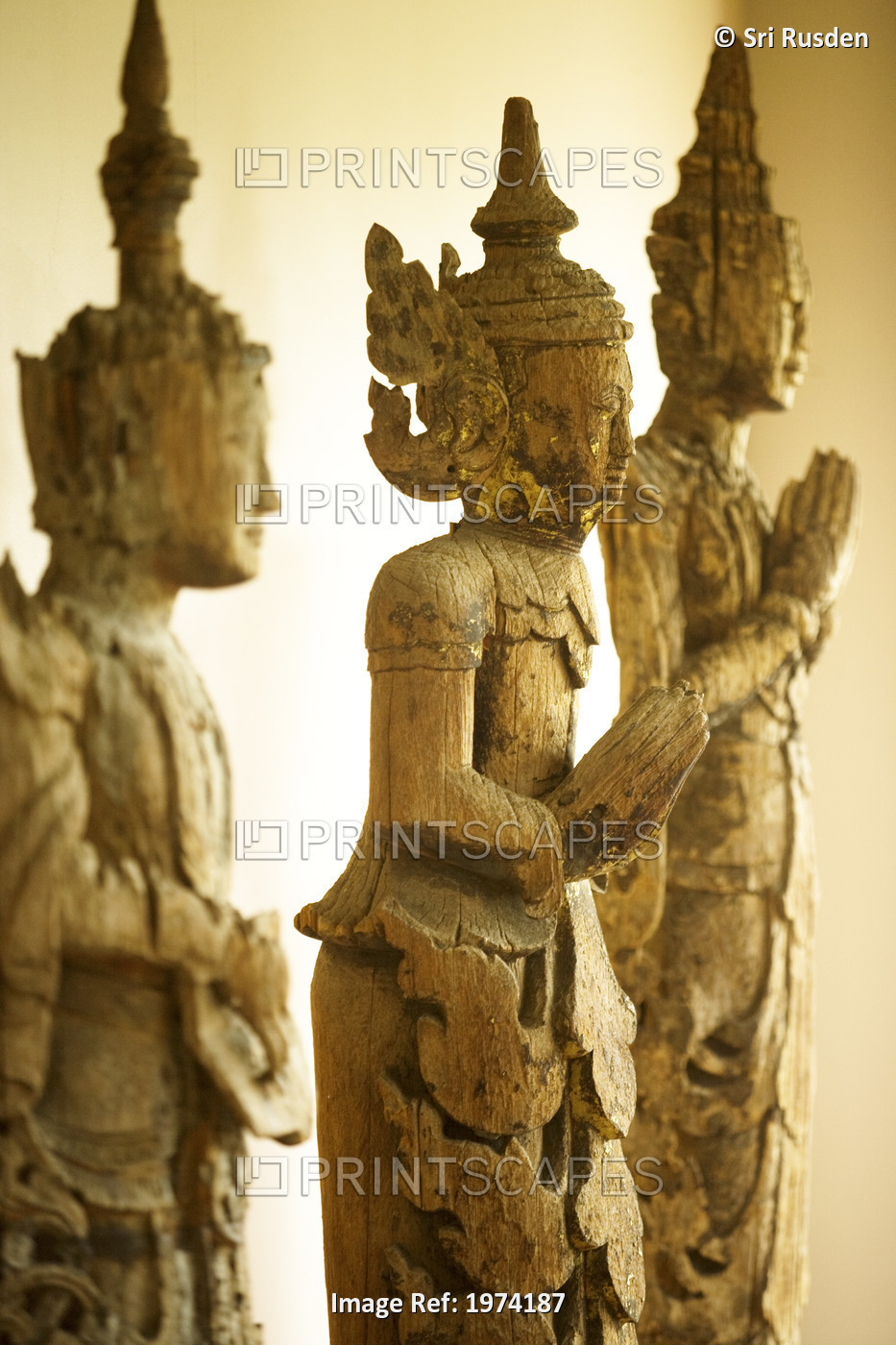 Close-Up On A Wooden Buddha Sculptures (Sepia Photograph).