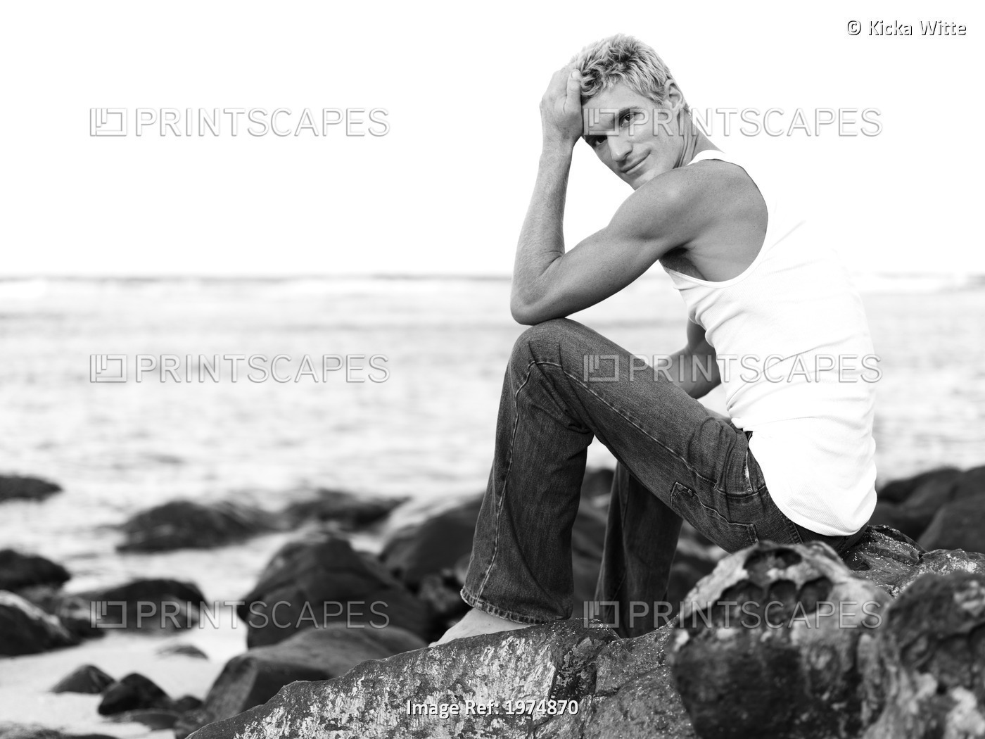 Hawaii, Kauai, Fit Male Posing On Rocky Coastline.