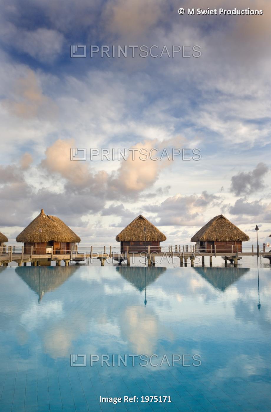 French Polynesia, Pearl Resort, Bungalows Over Beautiful Turquoise Ocean.