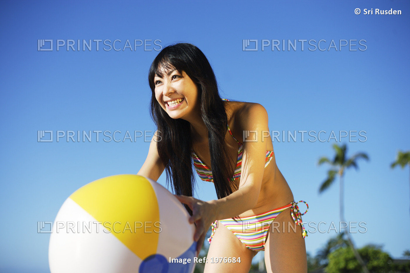 Young Japanese Girl Playing With Beach Ball.