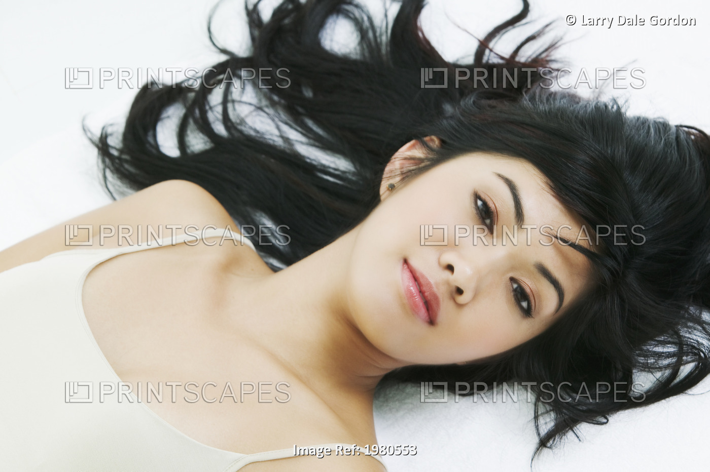 Close-Up Of A Beautiful Asian Woman Laying Down.