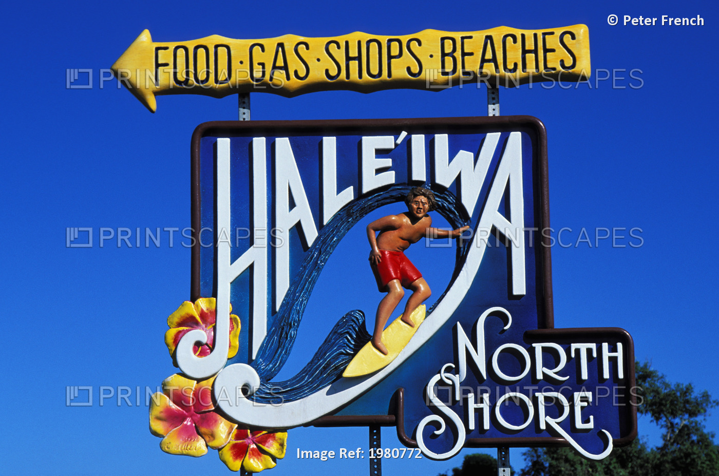 Haleiwa Town Sign With Surfer On The Side Of The Road; Haleiwa, Oahu, Hawaii, ...