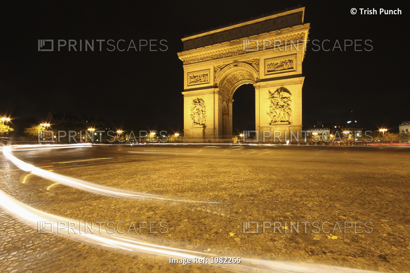 Traffic Light Trails Around The Arc De Triomphe; Paris France