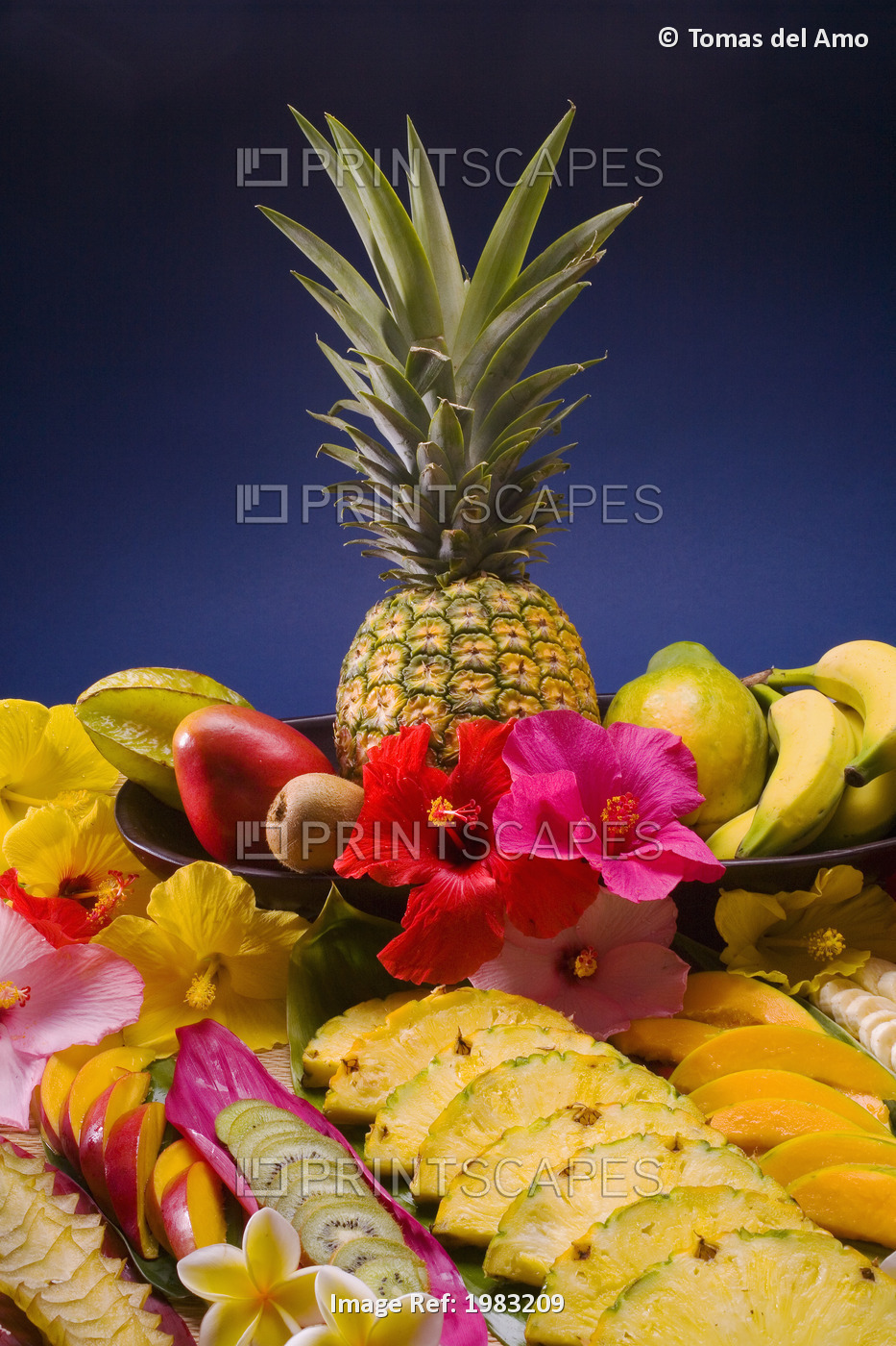 Studio Shot Of A Variety Of Tropical Fruit, Whole And Cut Into Slices.
