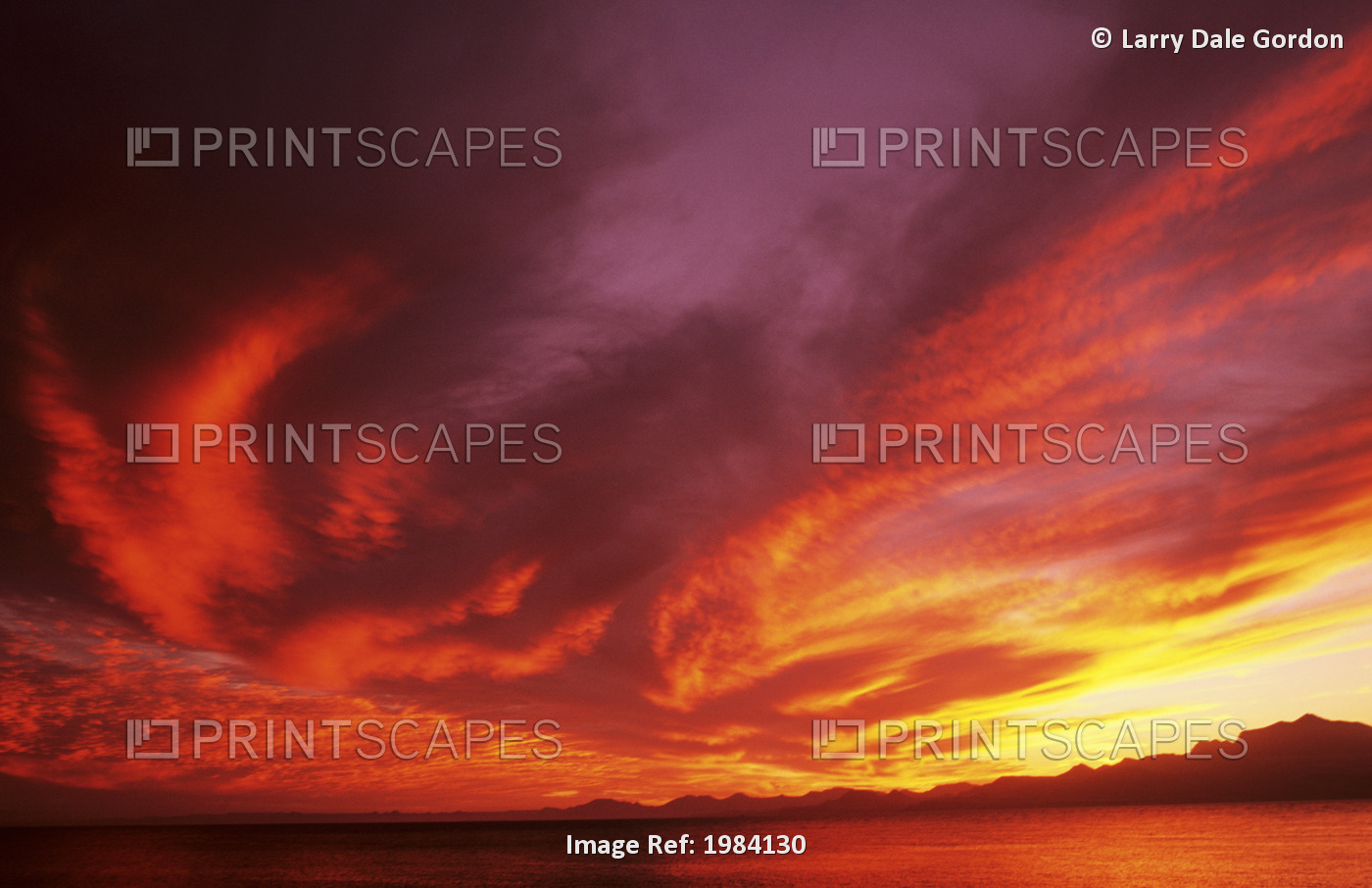 Sunset Over Seascape, Brightly Colored Clouds Illuminated Over Ocean.