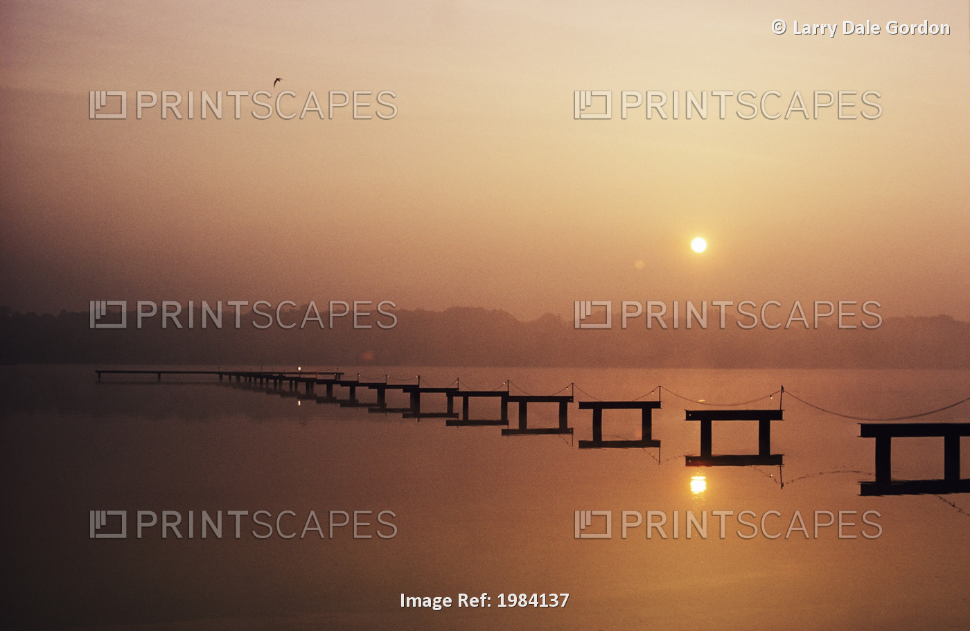 USA, New Jersey, Sunrise over inland waterway with reflections in smooth water; ...