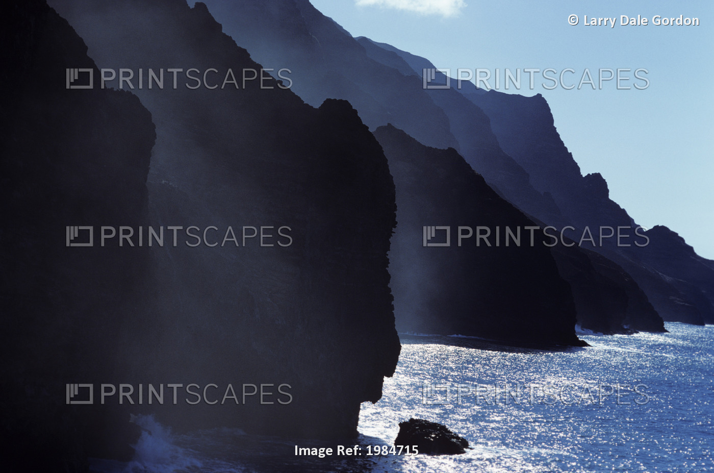 USA, Hawaii Islands, Kauai, Misty cliffs along ocean shoreline; Na Pali Coast