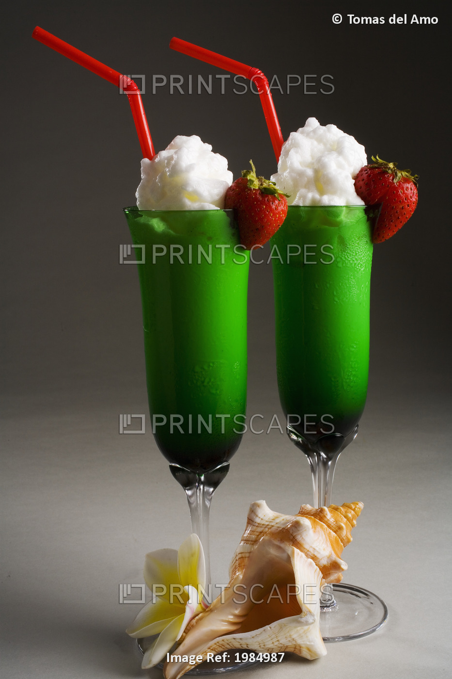 Close-Up Of Two Green Glasses Filled With A Creamy Tropical Drink.
