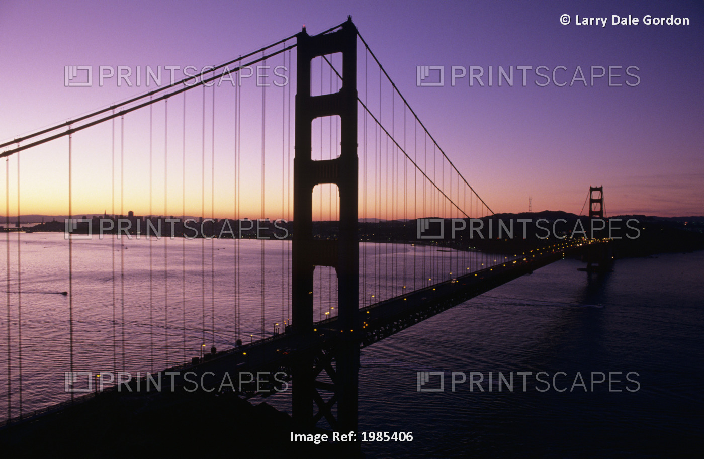 California, San Francisco, Golden Gate Bridge Silhouetted Against Evening Sky.