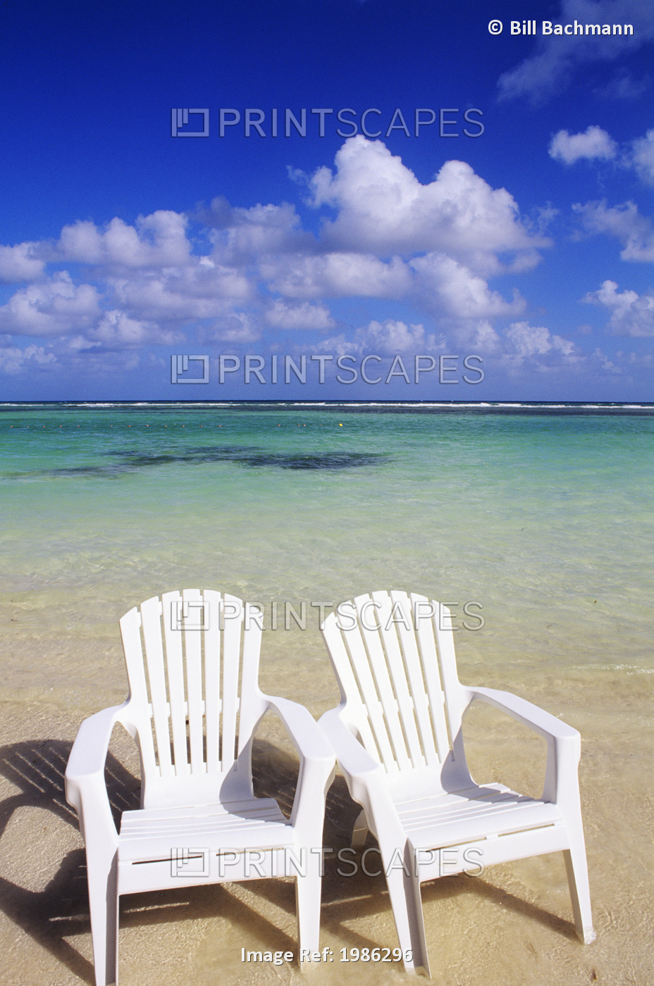 White Beach Chairs On Beautiful Beach, Clear Turquoise Water.
