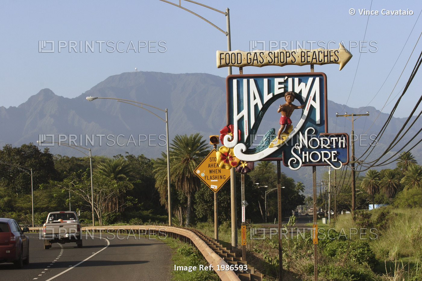 Welcome Sign For The Town Of Haleiwa On The Side Of A Road; Oahu, Hawaii, ...