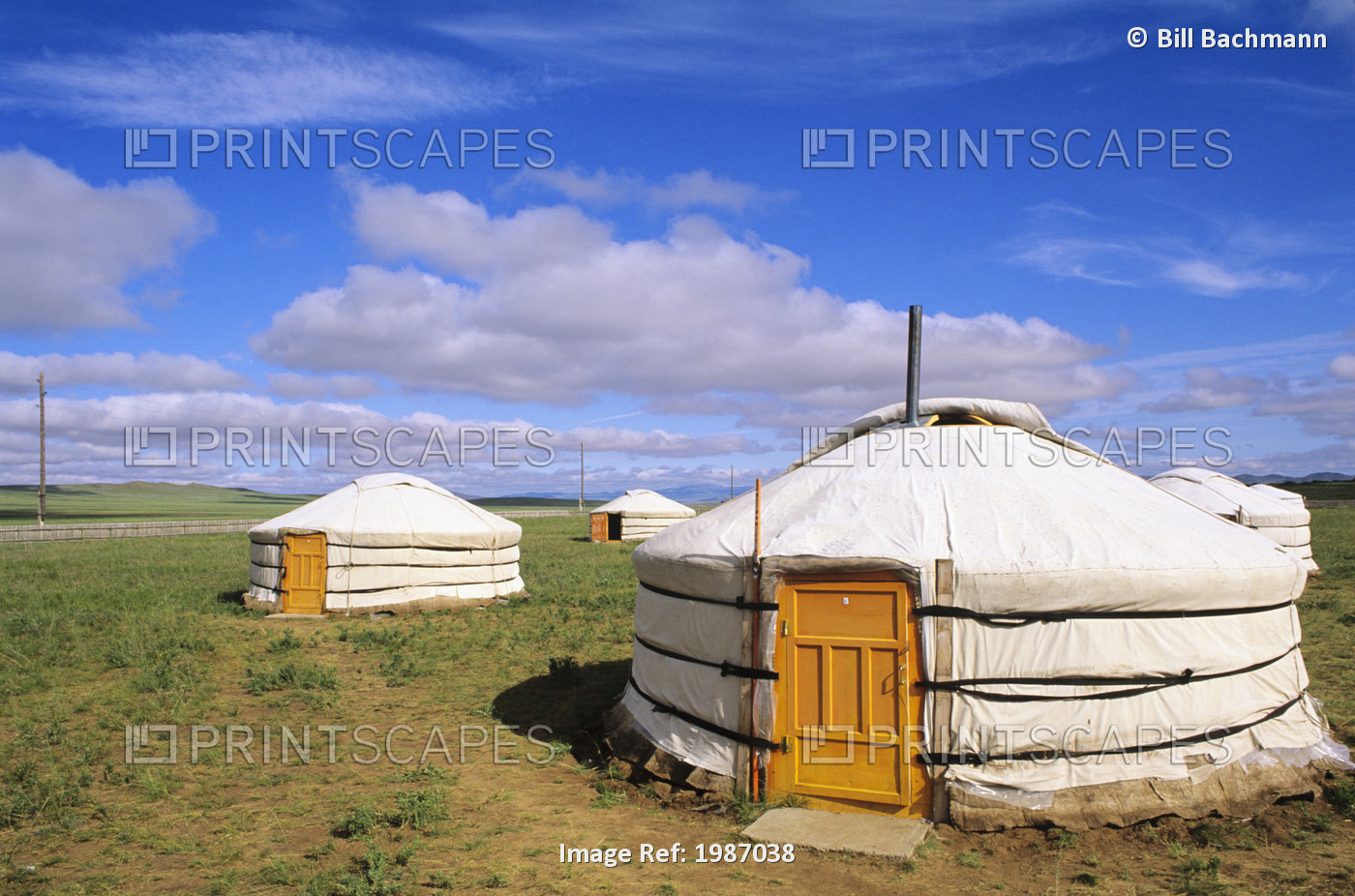Mongolia, Traditional nomadic homes on flat grassy countryside; Ger Ranch