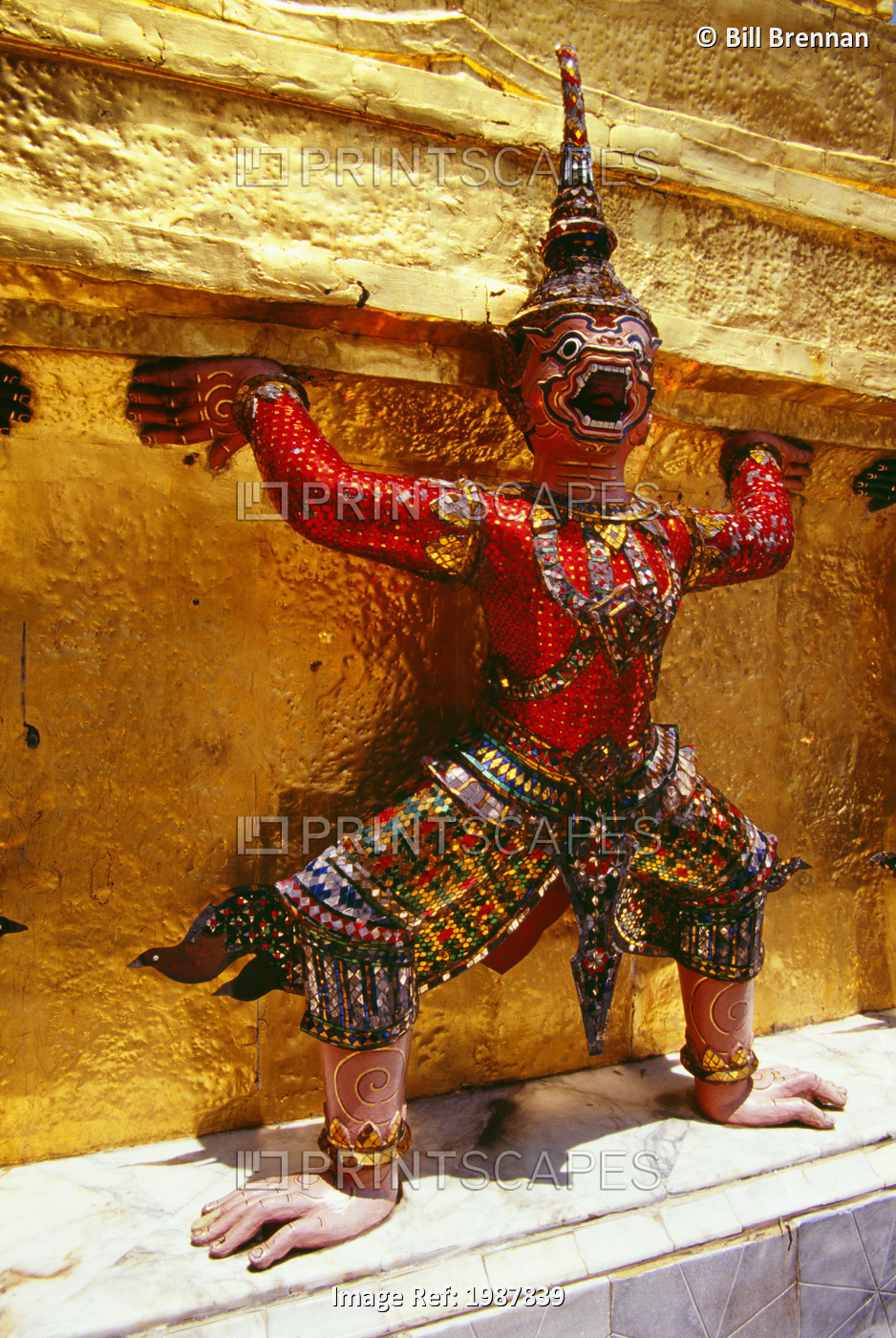 Thailand, Ramakien statue in colorful outfit and headdress in Wat Phra Keo; ...
