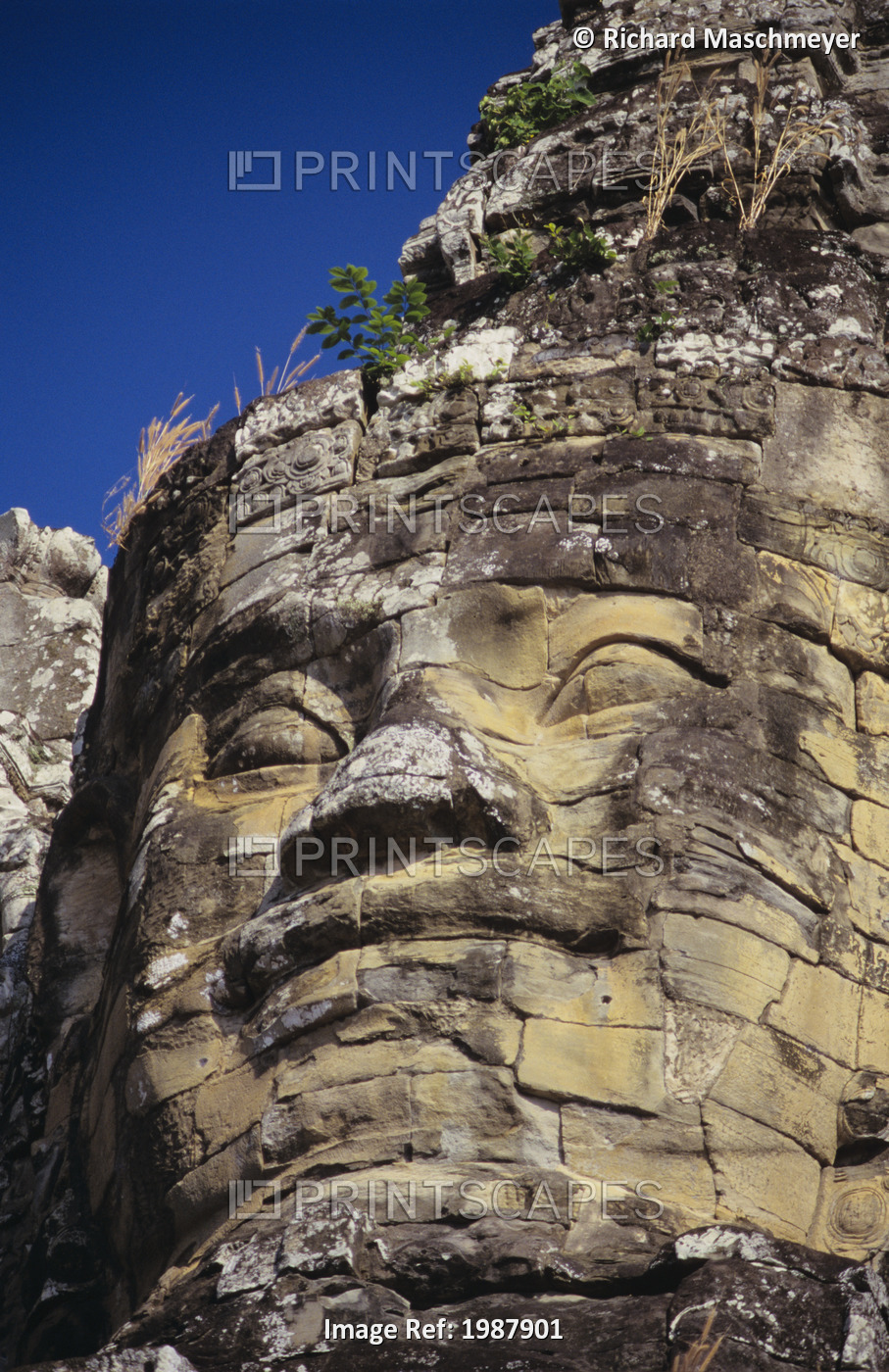 Cambodia, Angkor Thom, Close-up of stone face carving on south temple gate; ...