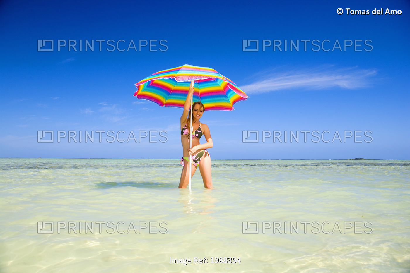 Hawaii, Oahu, Kaneohe, Woman Standing Under A Brightly Colored Umbrella In ...