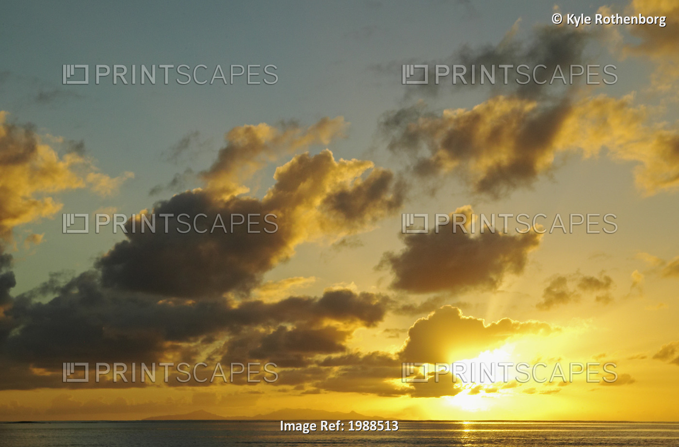 French Polynesia, Raiatea, Sun Shining Through Clouds Over The Ocean At Sunset