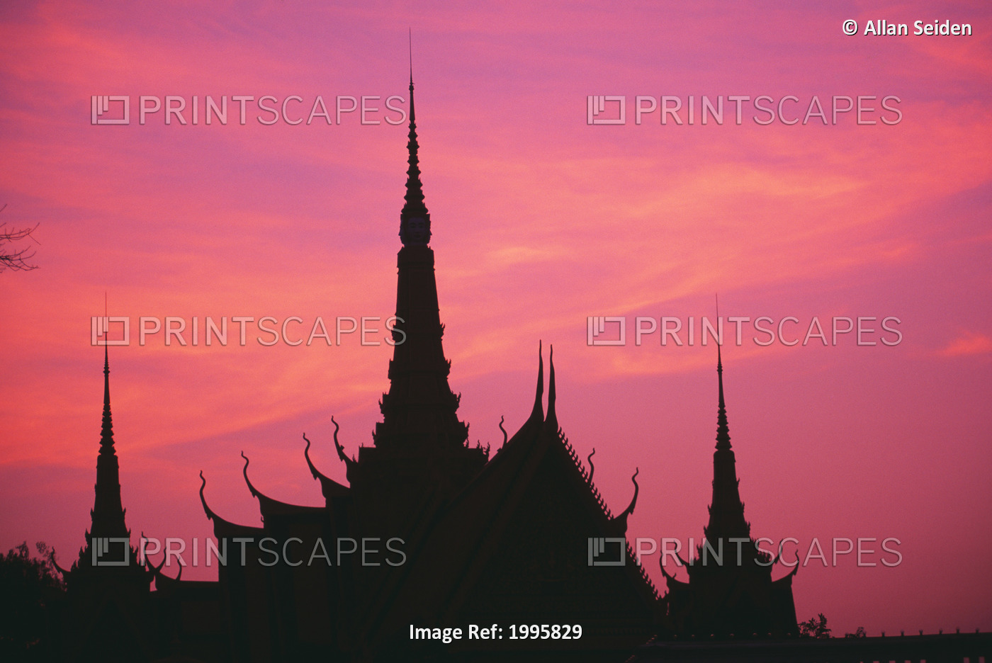 Cambodia, Phnom Phen, Silhouette Of Palace Architecture At Sunset.