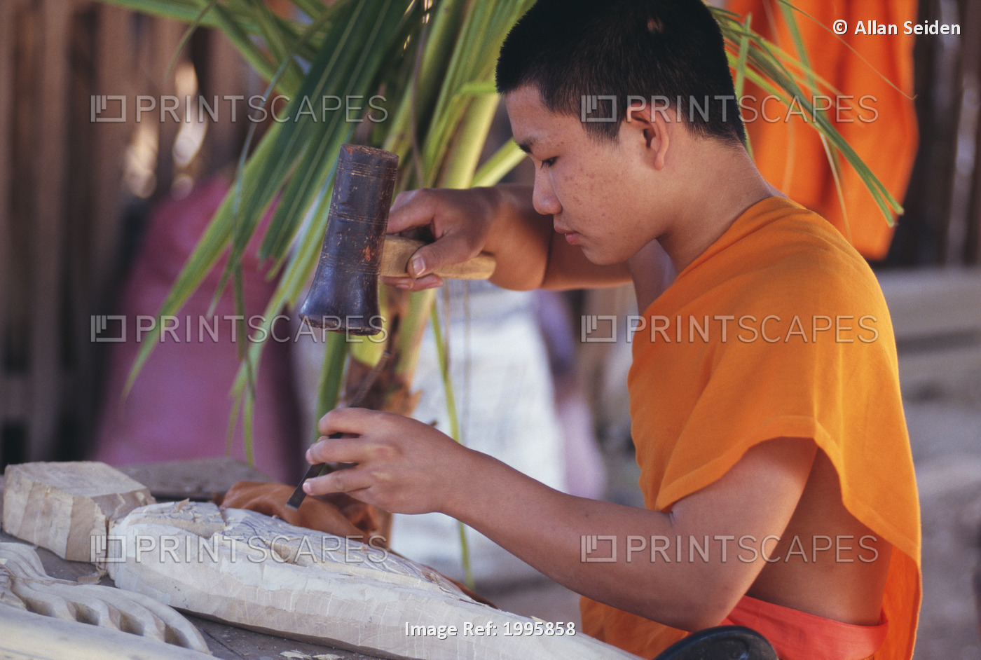 Laos, Luang Prabang, Young Monk Carving A Wood Filigree.