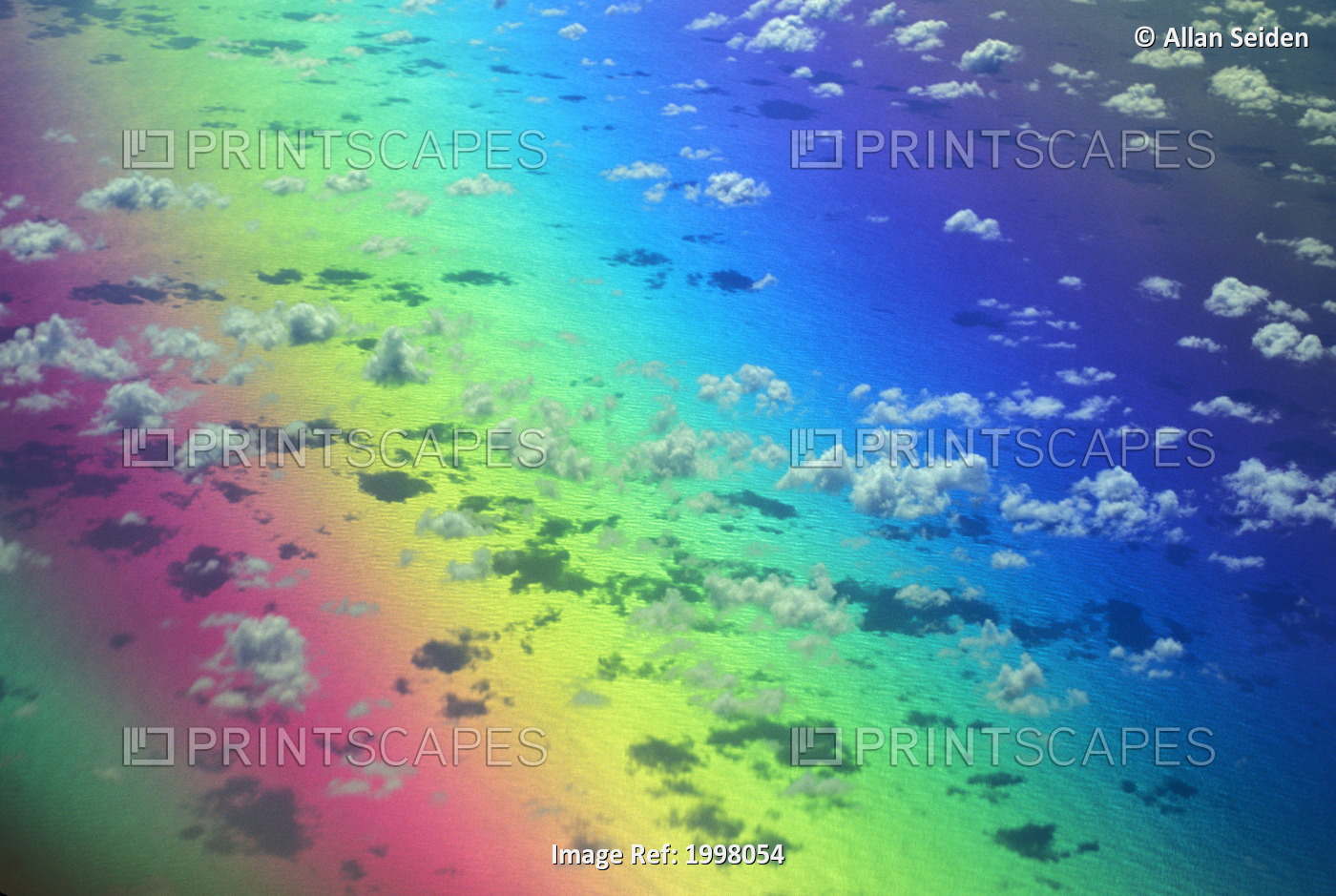Polarized Rainbow And Aerial Of Clouds Over The Ocean