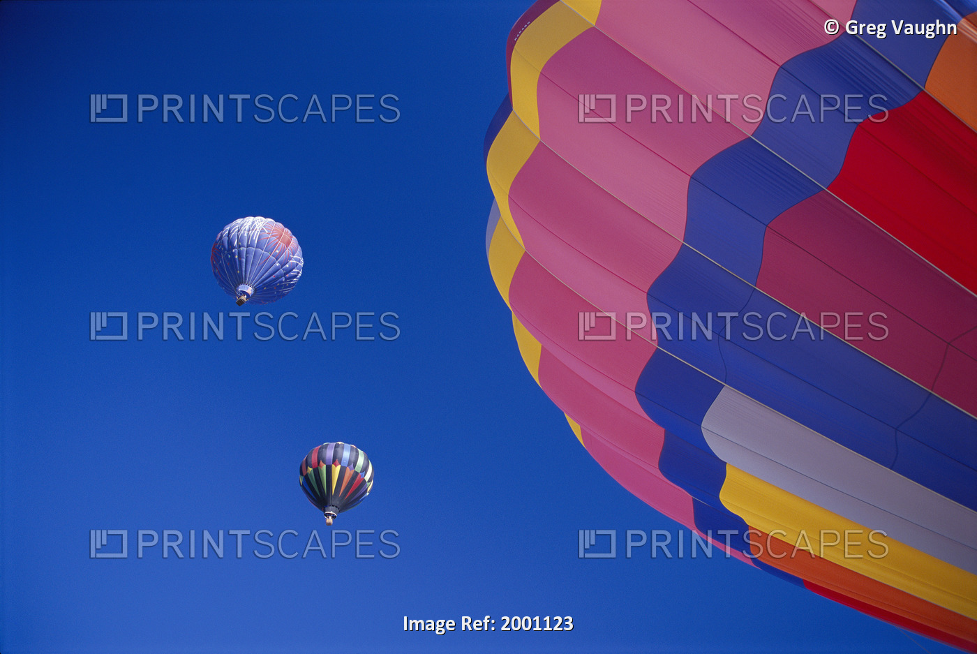 Colorful Hot Air Balloons Against Cloudless Blue Sky