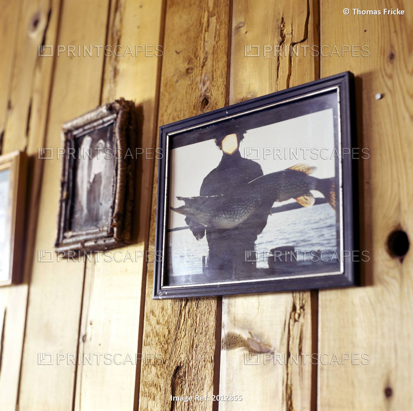 Framed Photos Of Fisherman In Cabin