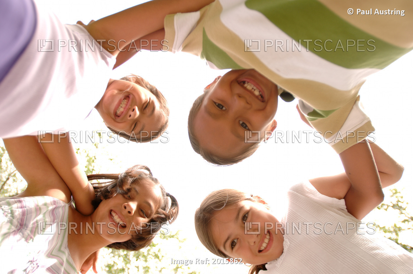 Children Stand In Circle With Arms Around Each Other