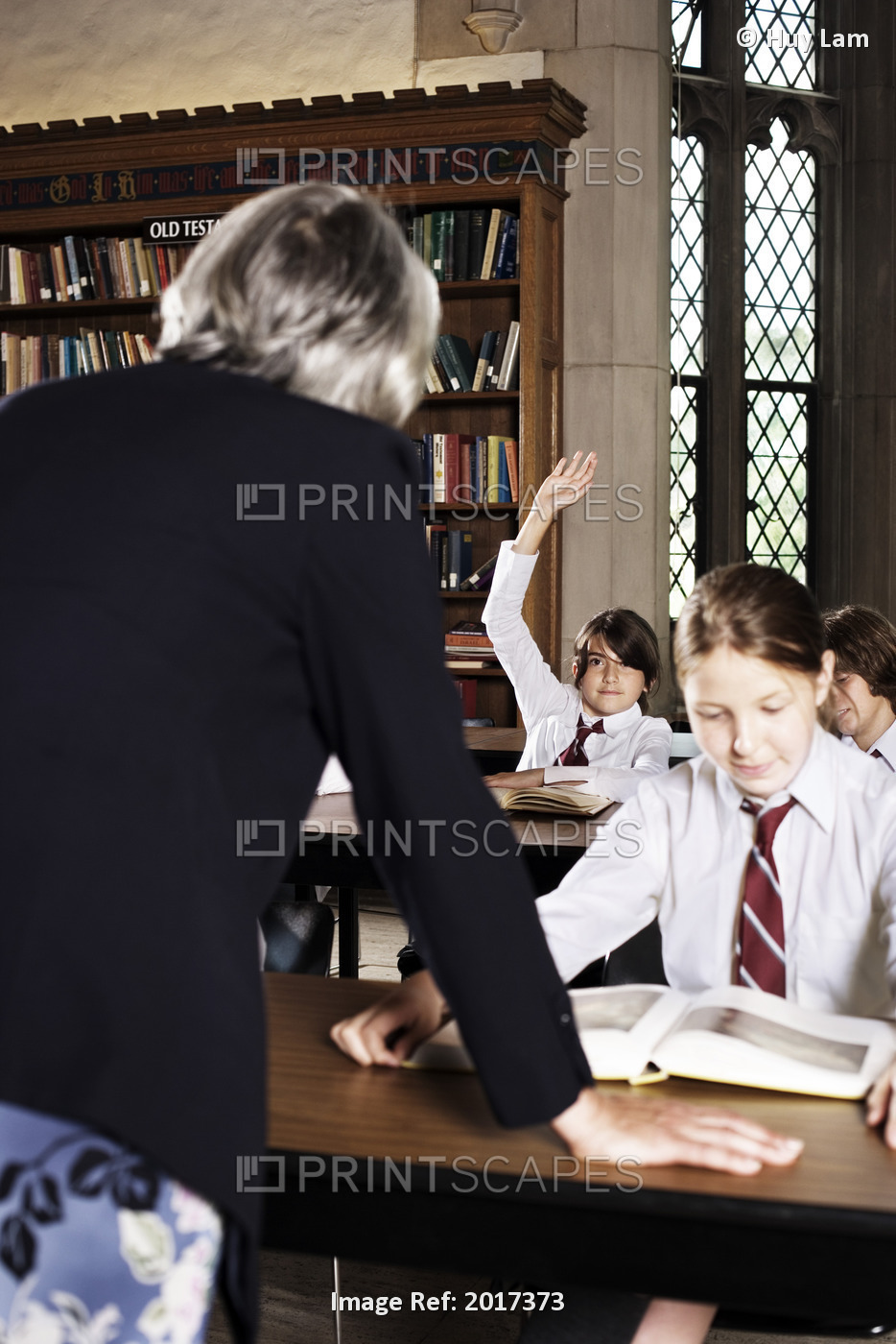 Teacher Talking To Students In Classroom