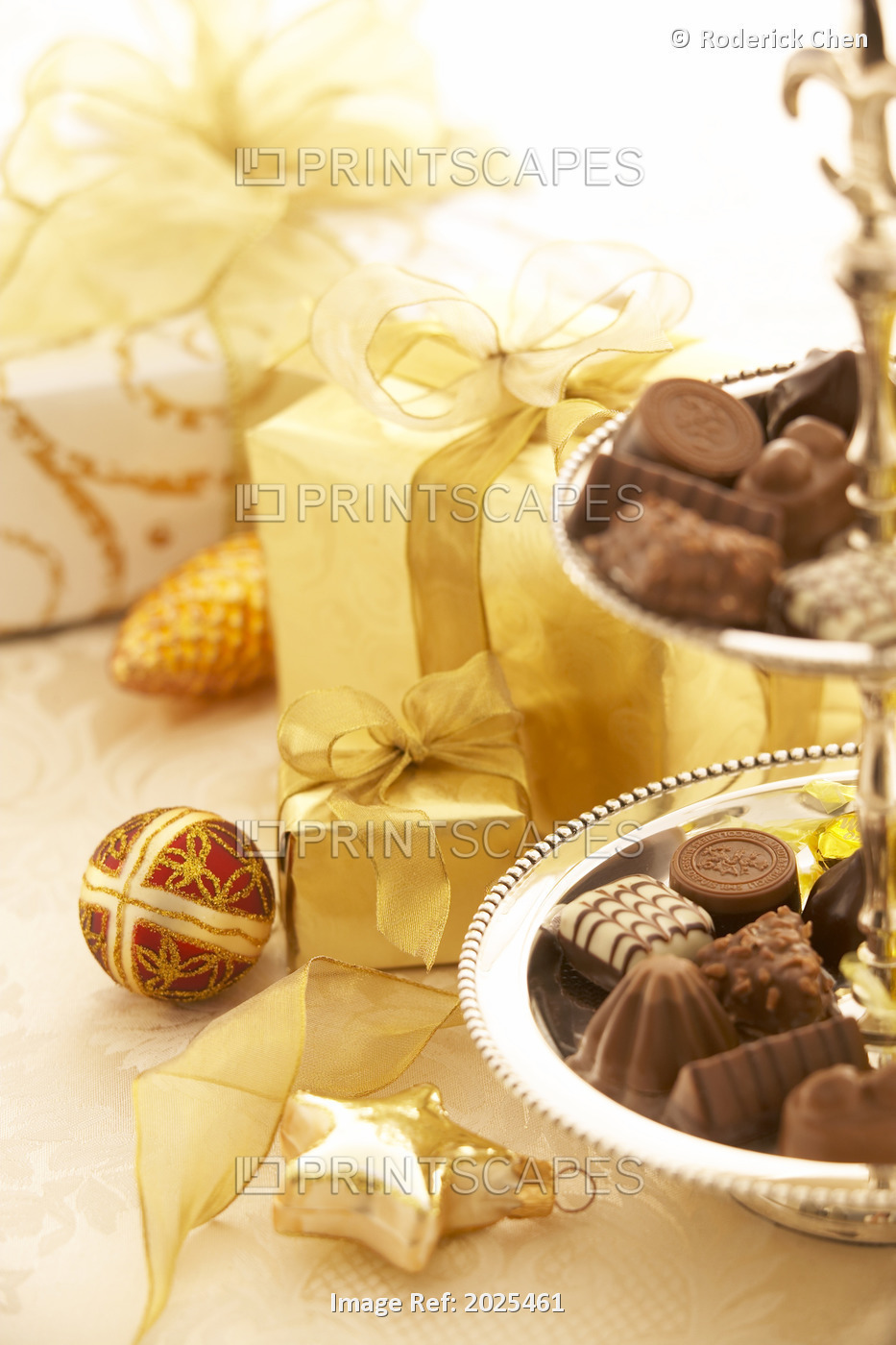 Chocolates And Presents Wrapped In Gold Paper