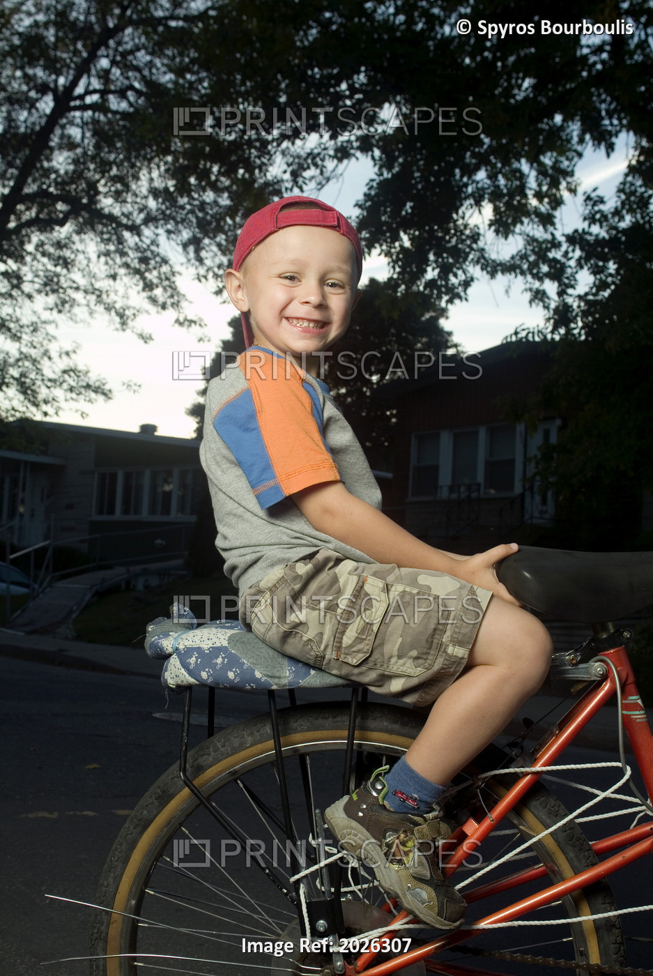 Little Boy On The Back Of An Adult Bicycle, Laval, Quebec