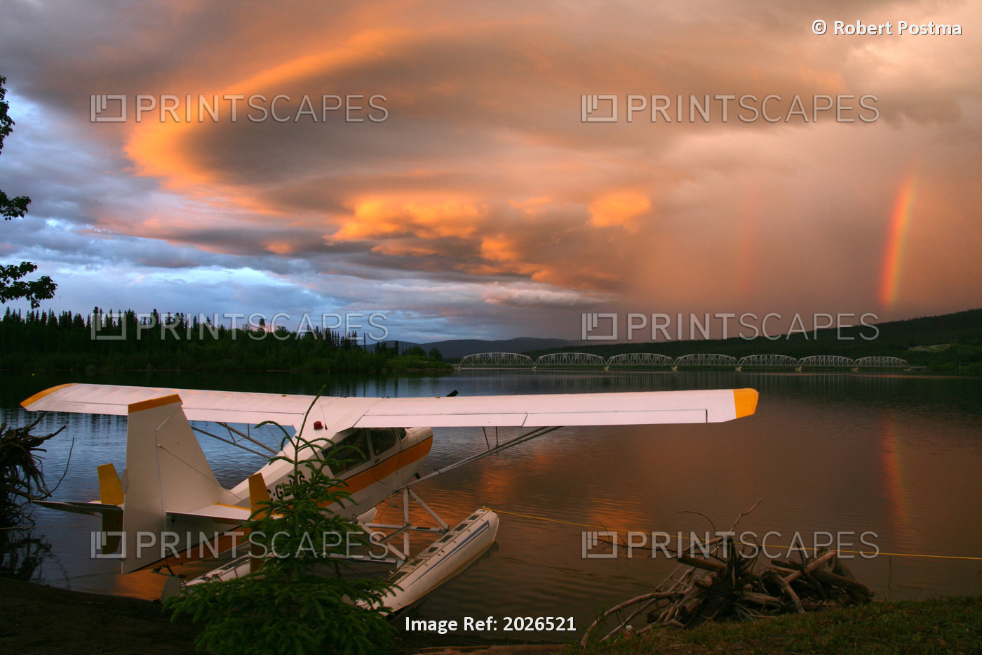 Sunlit Storm Clouds Over A Float Plane With Rainbow And Teslin Bridge In ...