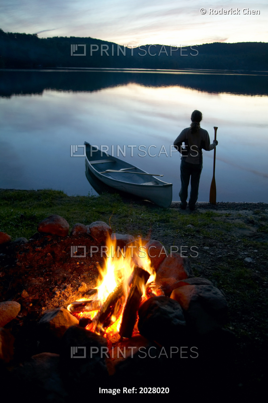 Silhouette Of A Woman Holding A Paddle Beside A Canoe, Lac Laurel, Quebec