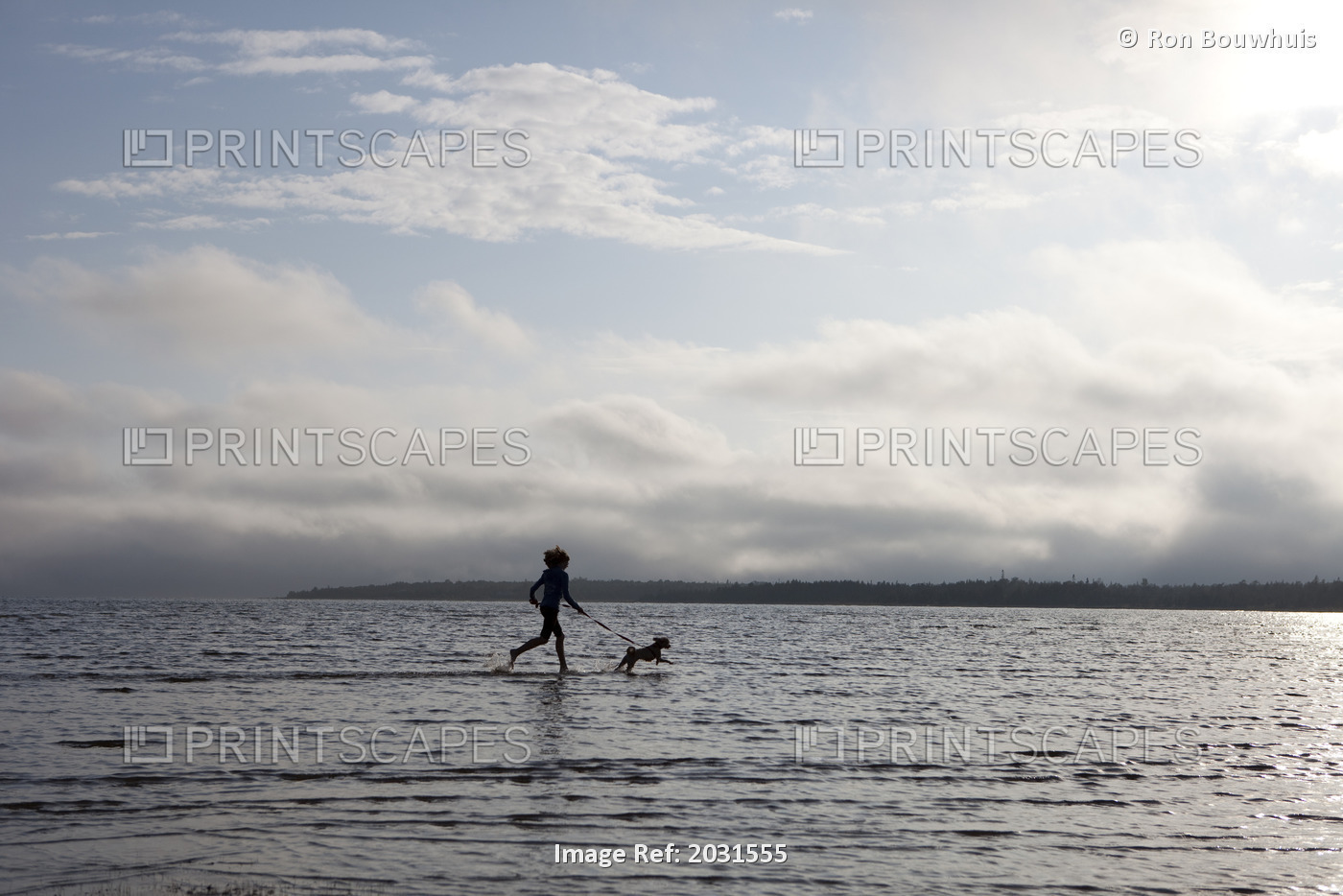 Girl Running With Shih-Bi Through Waters Of Lake Huron At Singing Sands Beach, ...