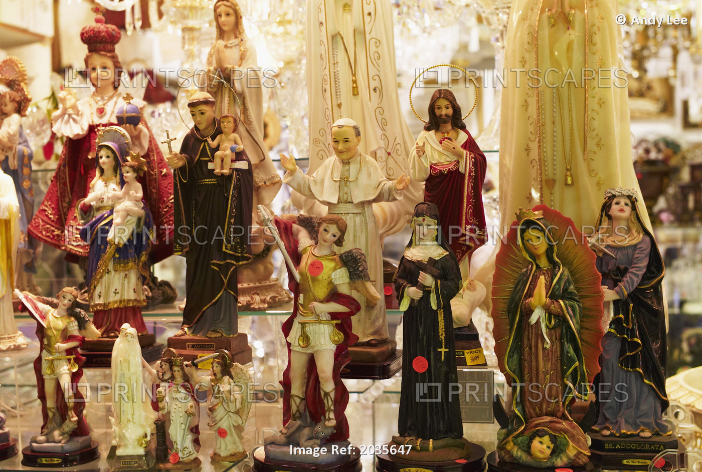 Close-Up Of Flea Market Stand Selling Christian Religious Idols.