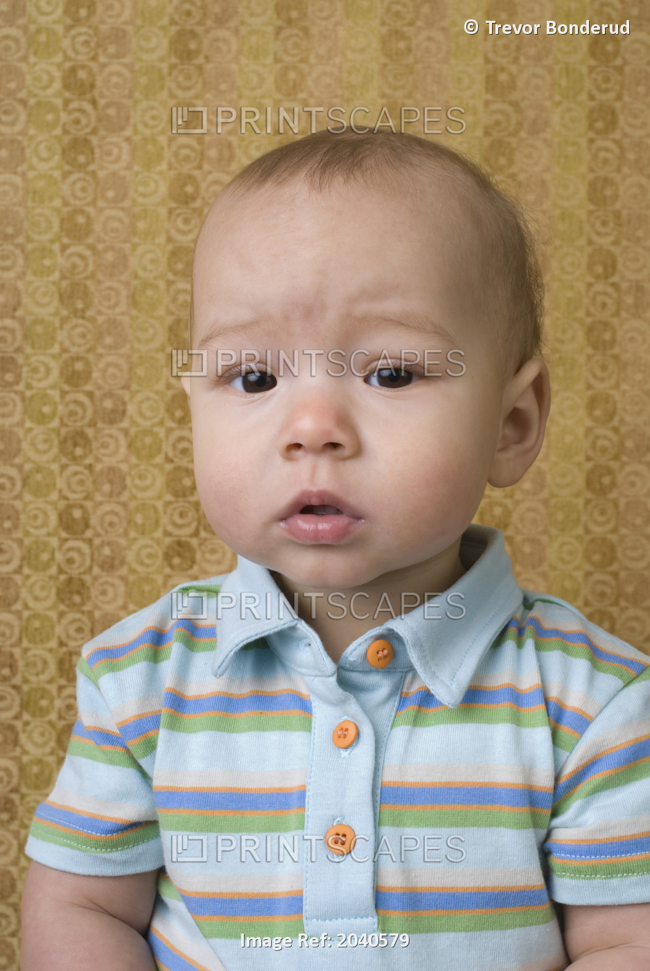 Portrait Of A Baby In Front Of A Patterned Background