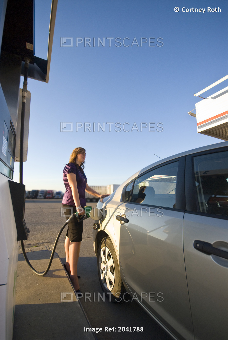 Businesswoman Pumping Gas, Regina, Saskatchewan