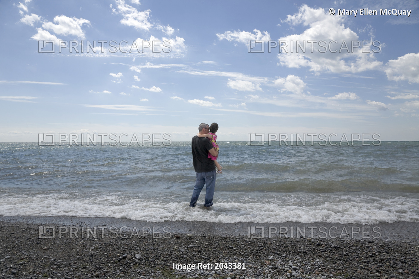 Father Holding His Daughter And Standing In The Surf At The Lakeshore, Ontario