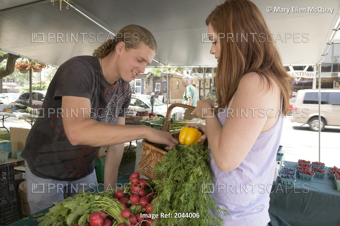 Young Woman Purchasing Vegetables At A Farmer's Market, Whitby, Ontario