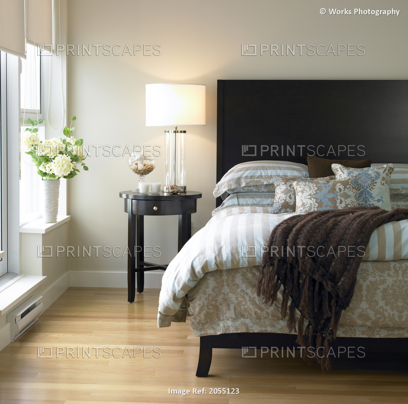 Bedroom With Blue And Brown Bedding, Bedside Table And Hydrangeas In Vase, ...